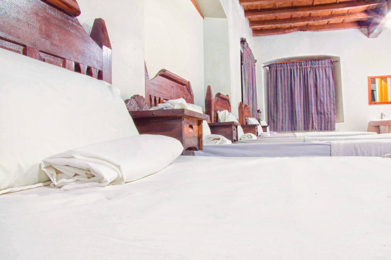 Family Room 3 with a spacious 10-pax layout and multiple comfortable beds at Casa de Gabriela