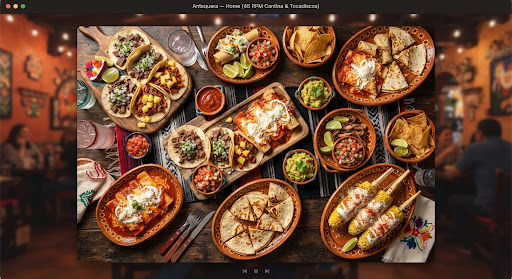 Overhead party spread of tacos, enchiladas, salsas, guacamole, and street corn.