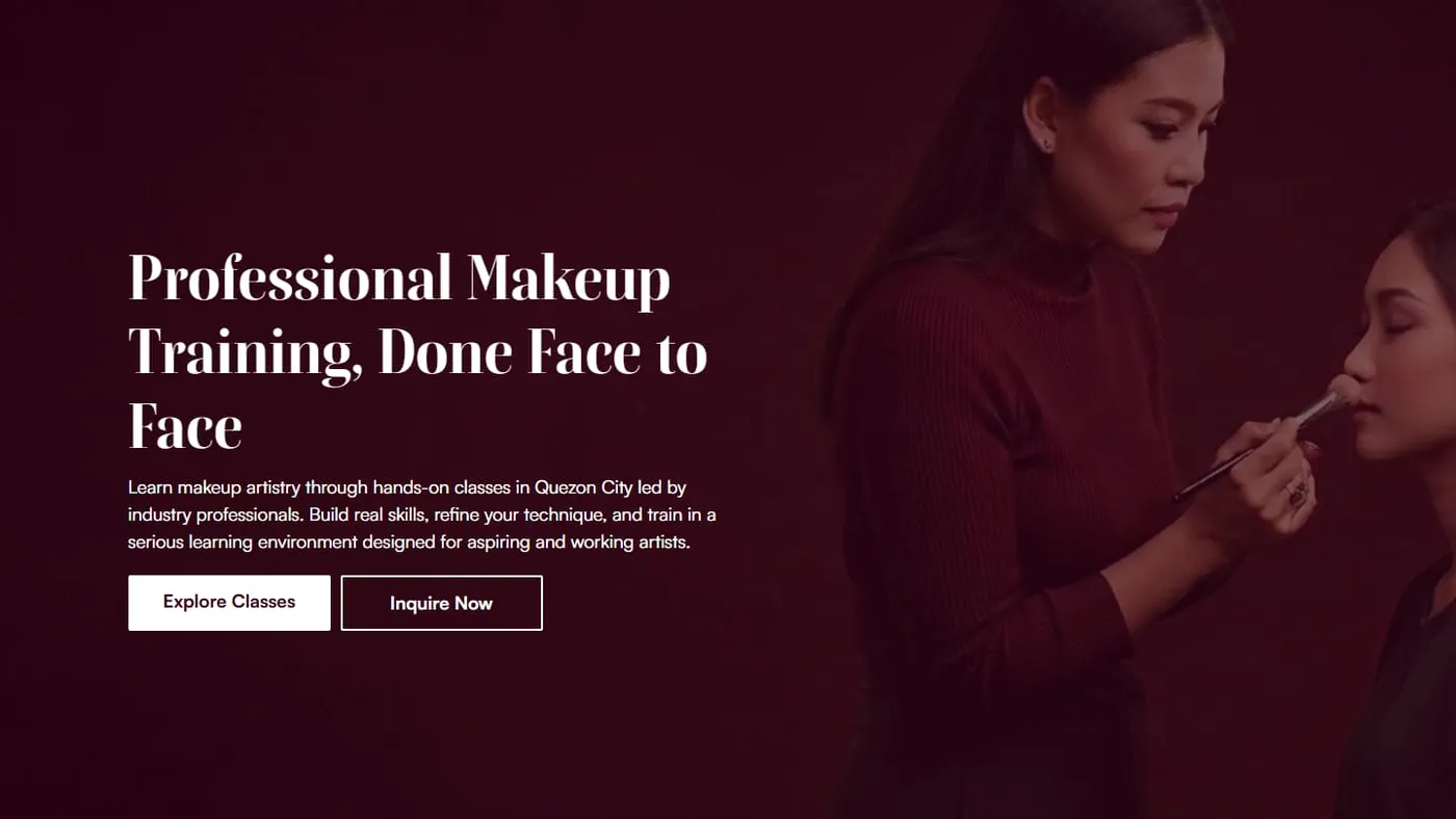 The makeupacademymanila.com homepage: an instructor applying makeup to a client in a maroon-lit studio, beside the headline "Professional Makeup Training, Done Face to Face".